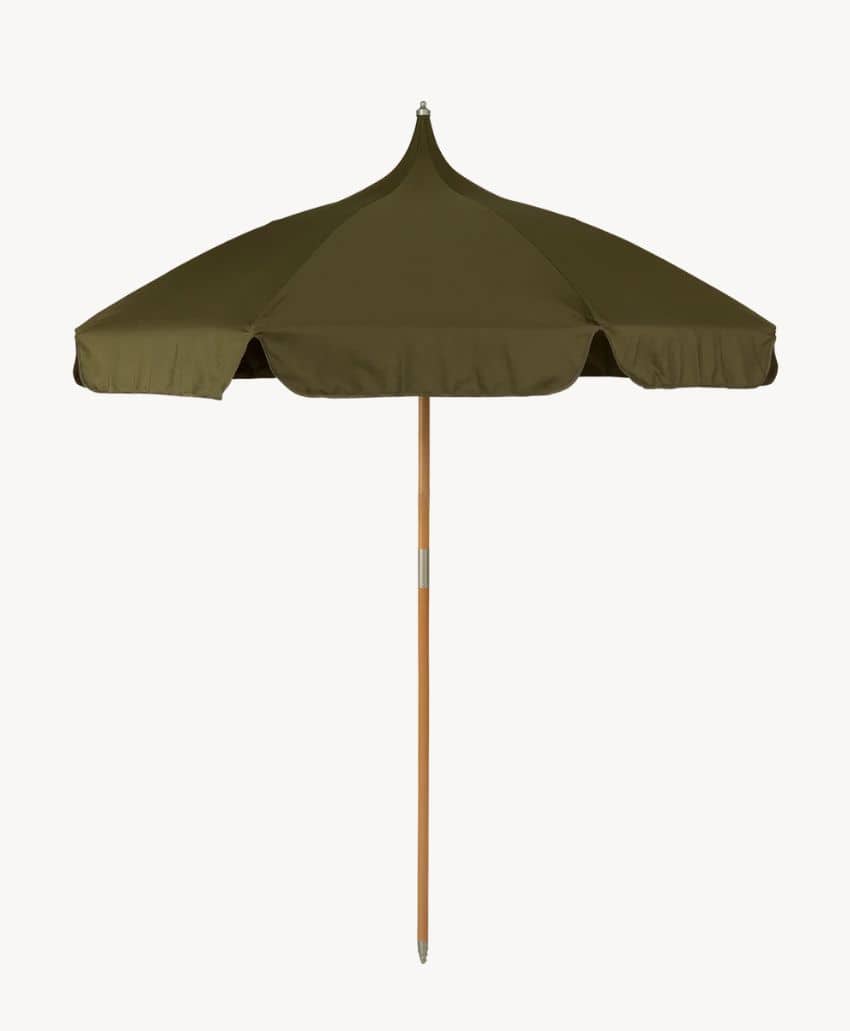 A green outdoor umbrella with a scalloped edge canopy, mounted on a wooden pole, shown against a plain white background.