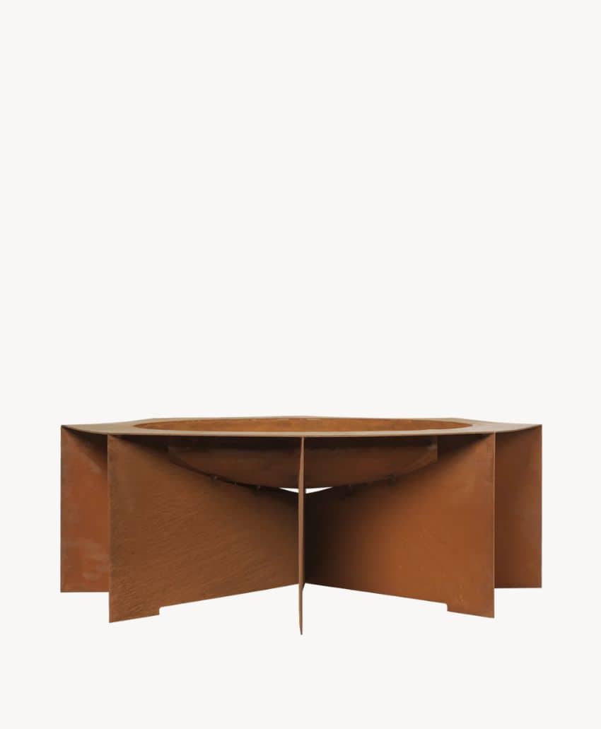 A rust-colored, geometric metal fire pit with a circular top and four intersecting rectangular panels forming the base, displayed against a plain white background.