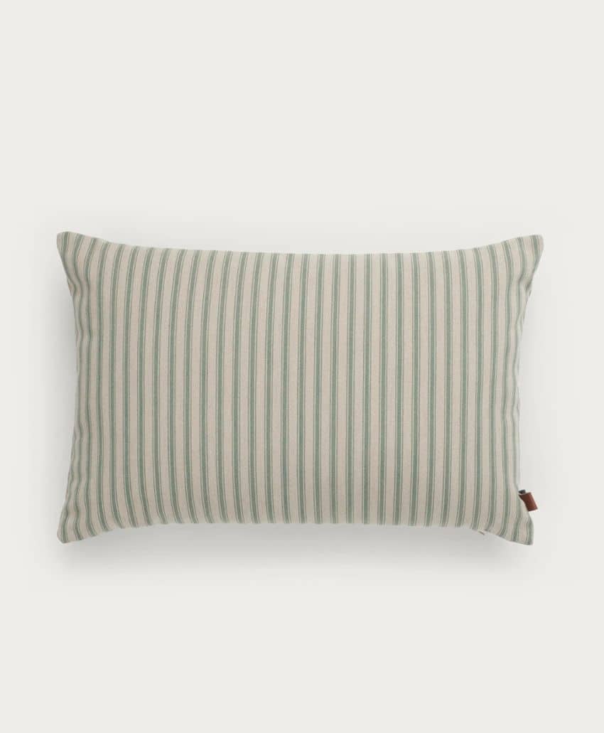 Rectangular pillow with vertical green and white stripes, shown on a plain white background. A small brown tag is attached to one side of the pillow.