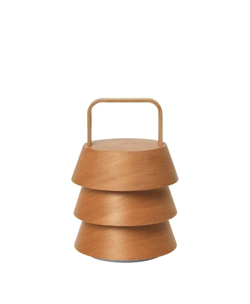 A modern, wooden lantern with three tiered, flared layers and a simple handle on top, shown against a plain white background.
