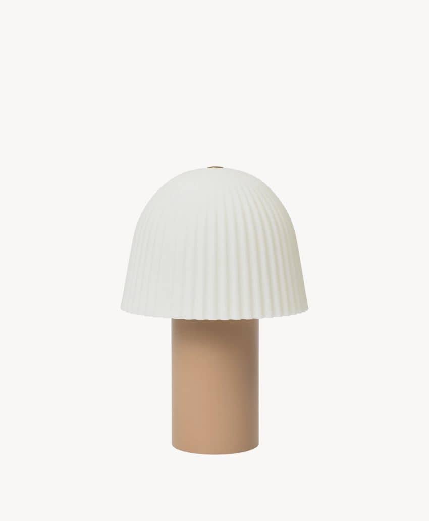 A modern table lamp with a beige cylindrical base and a white, pleated, dome-shaped lampshade against a plain white background.