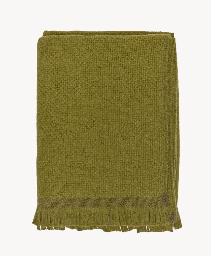 A folded olive green textured blanket with short fringe along the bottom edge, displayed on a plain white background.