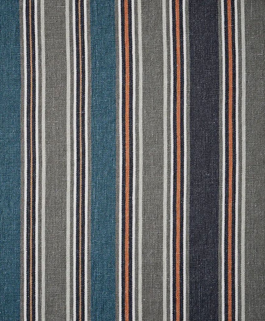 Fabric with vertical stripes in blue, gray, black, white, and orange. The stripes vary in width and are evenly spaced, creating a repeating, colorful pattern on a textured material background.