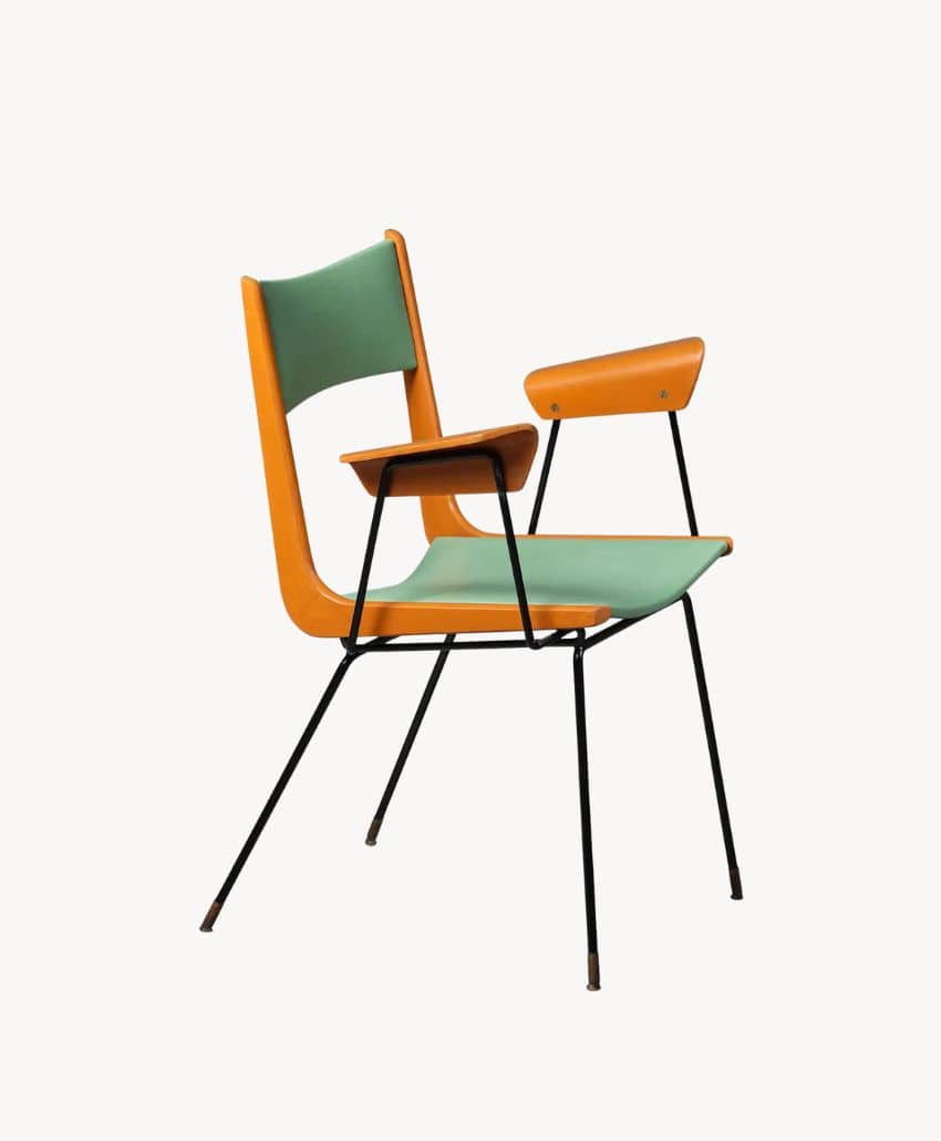A mid-century modern chair with a green seat and backrest, orange wooden frame and armrests, and slender black metal legs, against a plain white background.