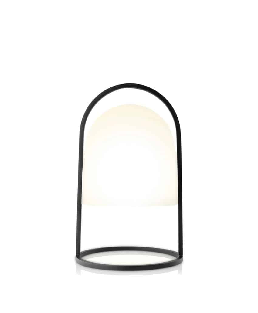 A modern table lamp with a round black metal frame and a white, dome-shaped light diffuser, set against a plain white background.