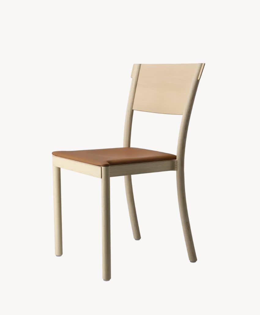 A modern wooden chair with a light-colored frame, a rectangular backrest, and a brown cushioned seat, set against a plain white background.
