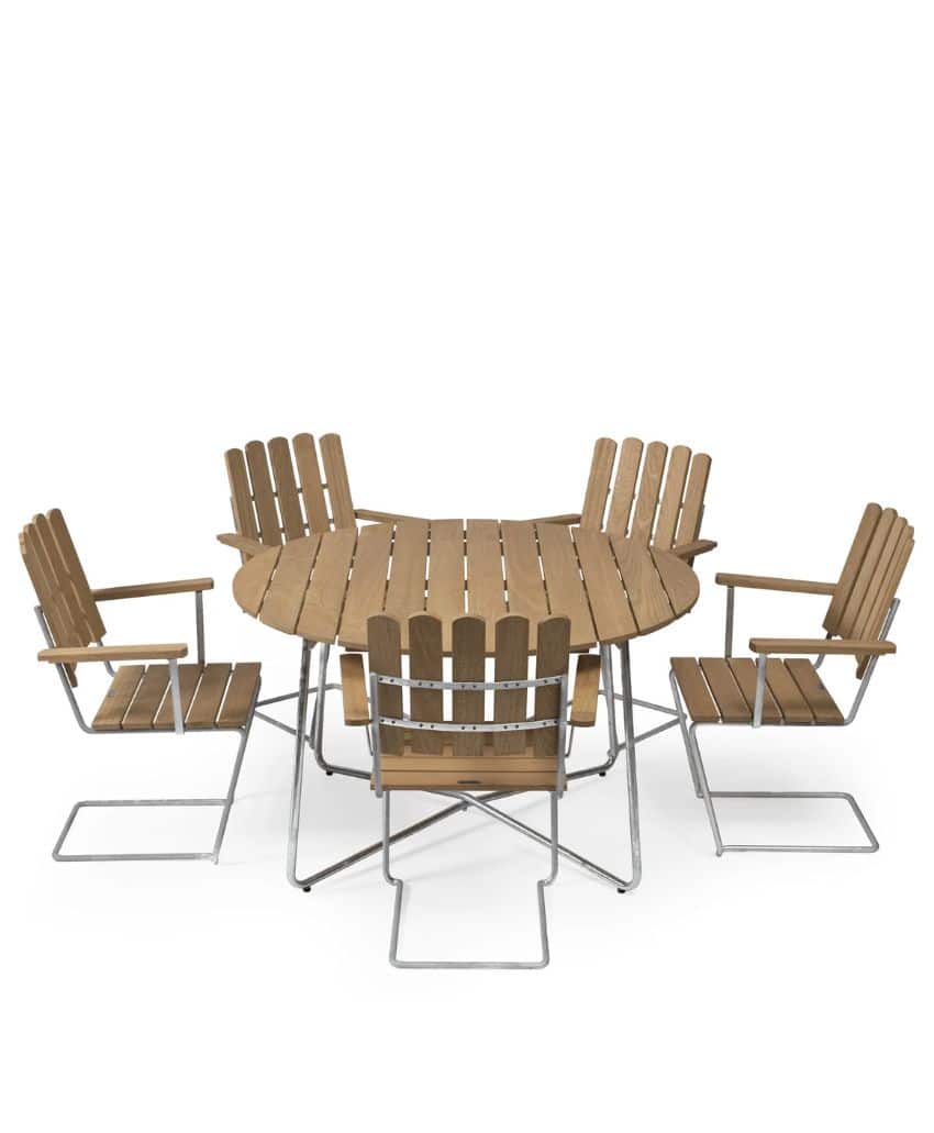 A round wooden outdoor table with matching wooden and metal chairs arranged around it, all featuring slatted backs and seats, on a white background.