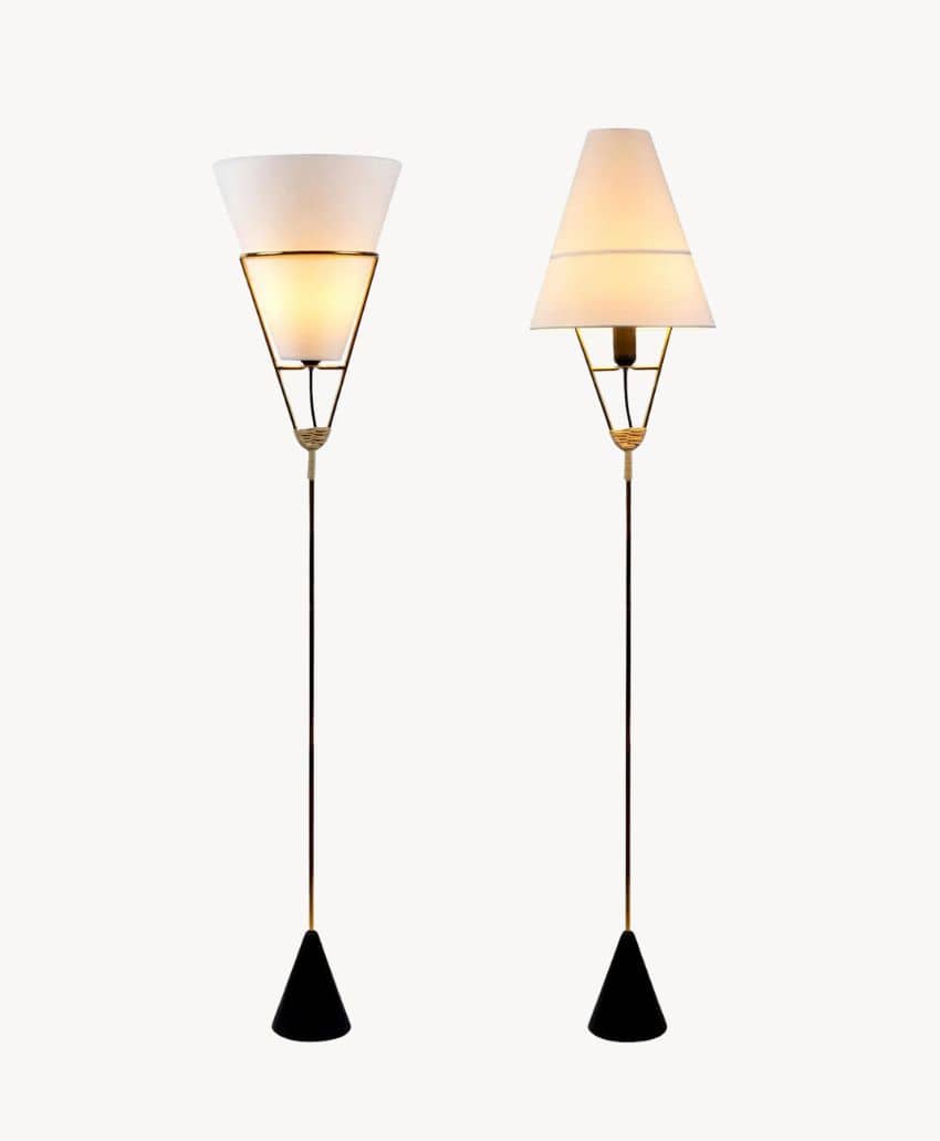 Two modern floor lamps with slender black stands, triangular bases, and white cone-shaped lampshades. The left lamp is lit, while the right lamp is turned off, both against a plain white background.