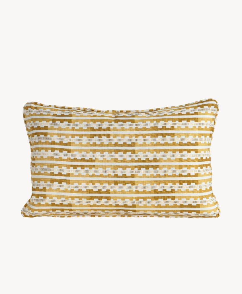 Rectangular throw pillow with a mustard yellow and white geometric striped pattern on a plain white background. The pillow has a slightly textured fabric and visible seams around the edges.