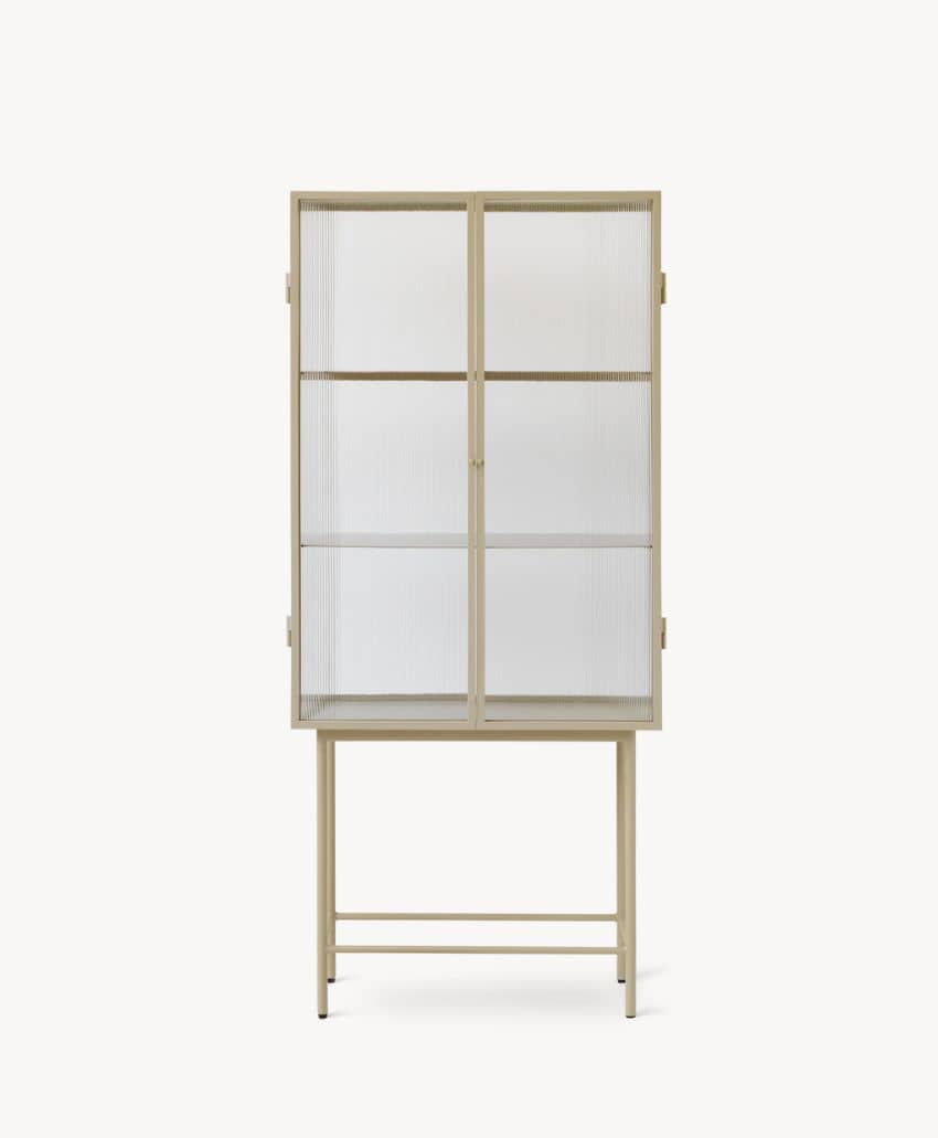 A light wood display cabinet with four glass panel doors and interior shelves, standing on tall legs against a plain white background.