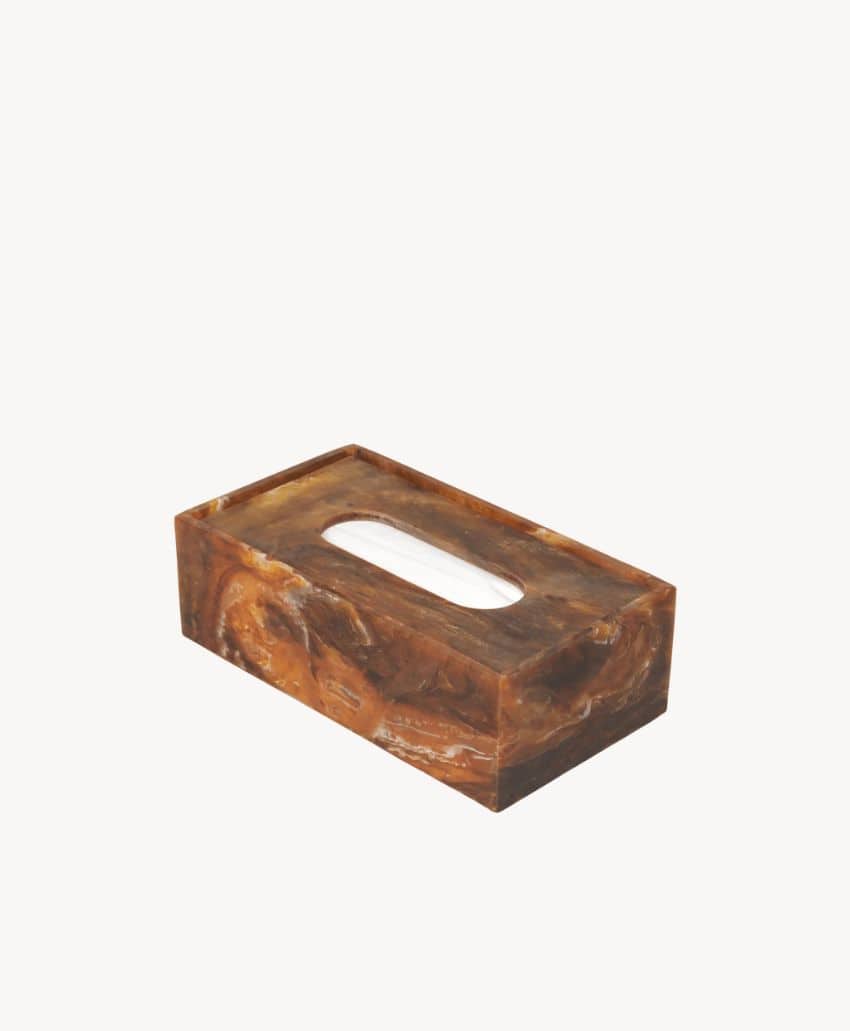 A rectangular brown marble-patterned tissue box cover with an oval opening on top, placed against a plain white background.