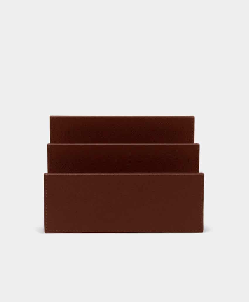 A brown, three-slot letter holder with a simple, rectangular design, set against a plain light gray background.