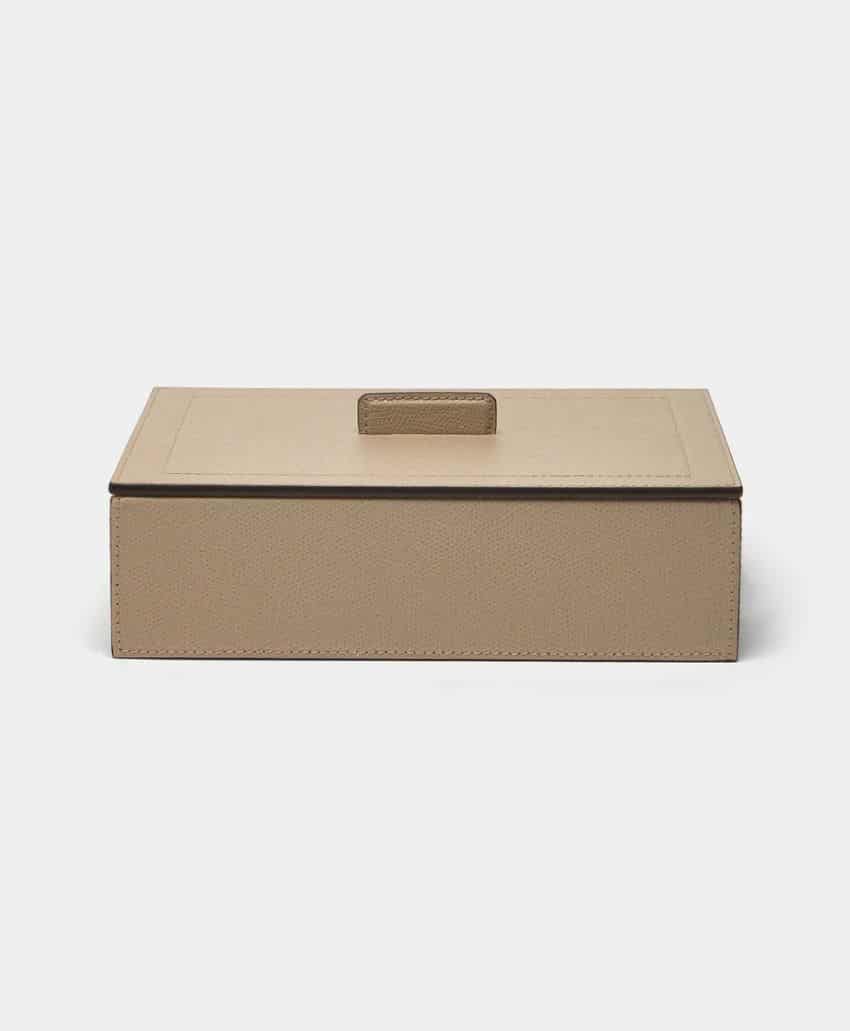 A rectangular, beige storage box with a matching lid and a centered handle, set against a plain light gray background.