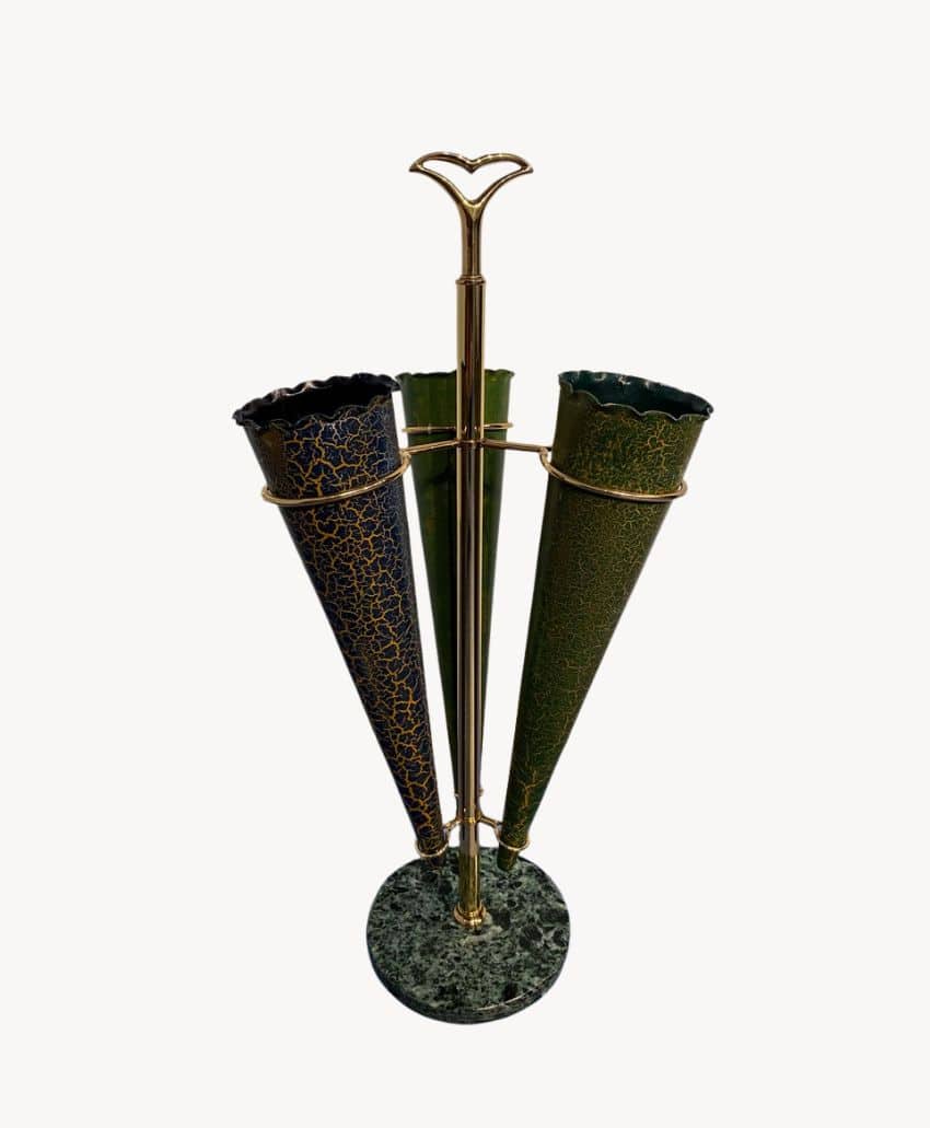 A decorative metal stand with a green marble base, holding three tall, cone-shaped vases with gold trim and crackled enamel surfaces in dark blue, green, and black.