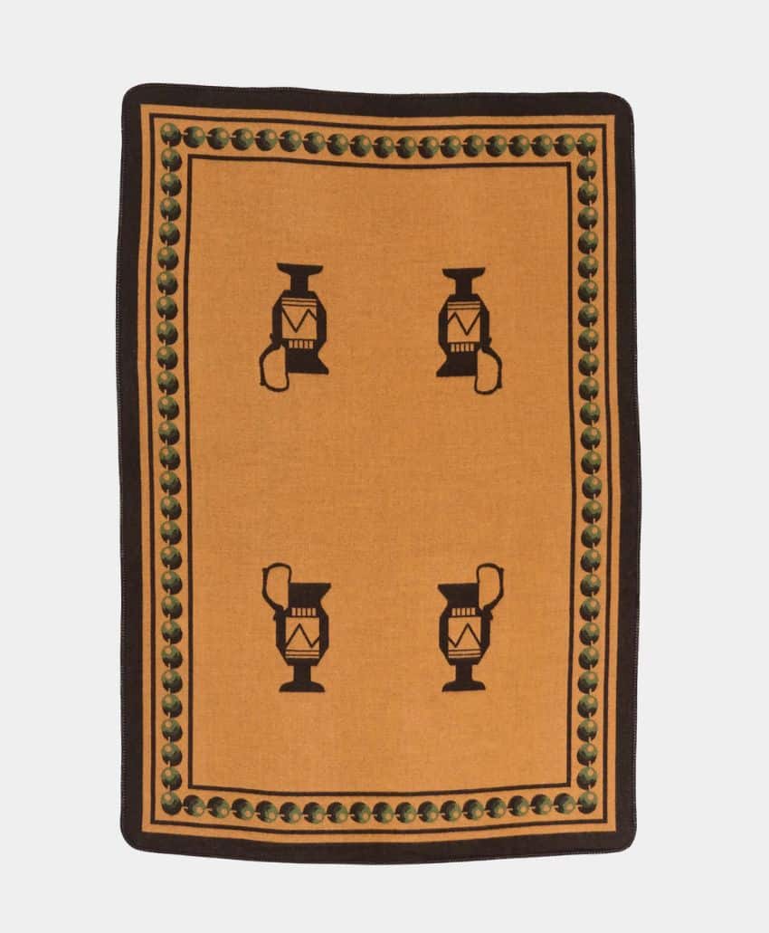 A rectangular rug with a mustard yellow center featuring four black and brown lantern motifs and a decorative border of green and black circular patterns on a dark brown background.