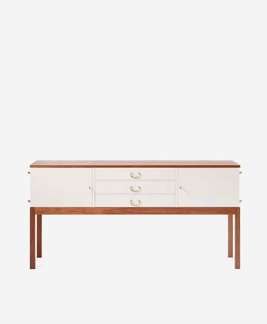 A modern sideboard with a wood frame and legs, cream-colored drawers and cabinets, and simple gold handles, set against a plain white background.