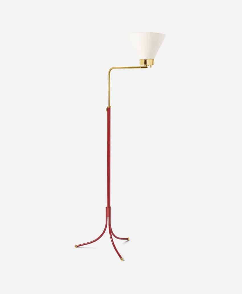 A modern floor lamp with a red tripod base, gold stem, and an upward-facing white cone-shaped lampshade, set against a plain white background.