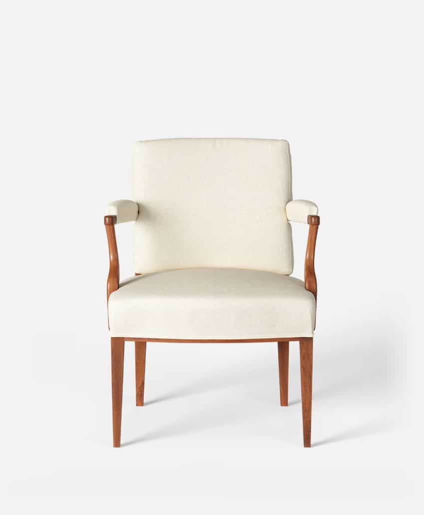 Front view of a modern armchair with light beige upholstery, wooden legs, and wooden armrests, set against a plain white background.