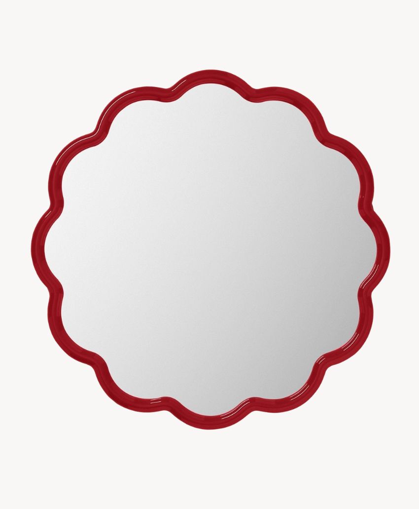 Round mirror with a scalloped edge and a glossy red frame, shown against a plain white background.