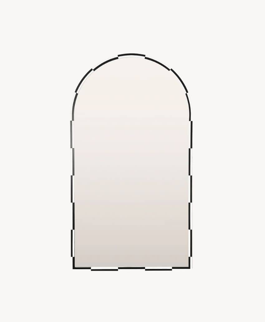 An arched wall mirror with a thin, segmented black frame on a plain white background.