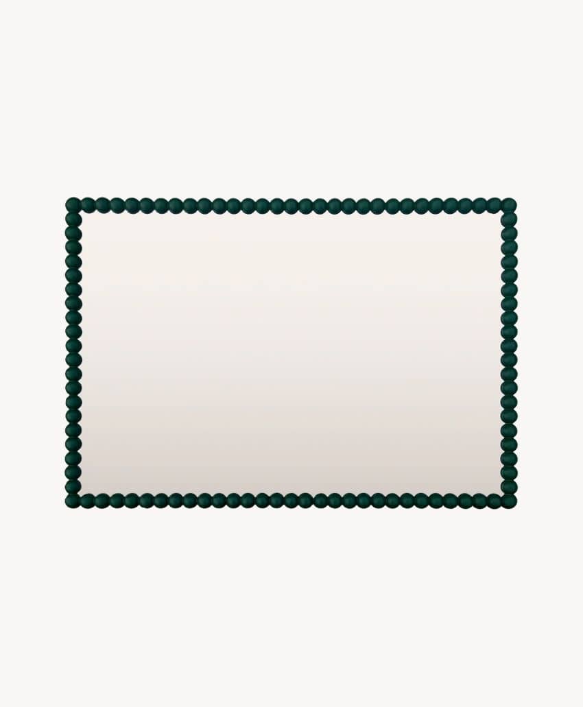 A rectangular mirror with a frame made of evenly spaced, round, dark green beads set against a plain white background.