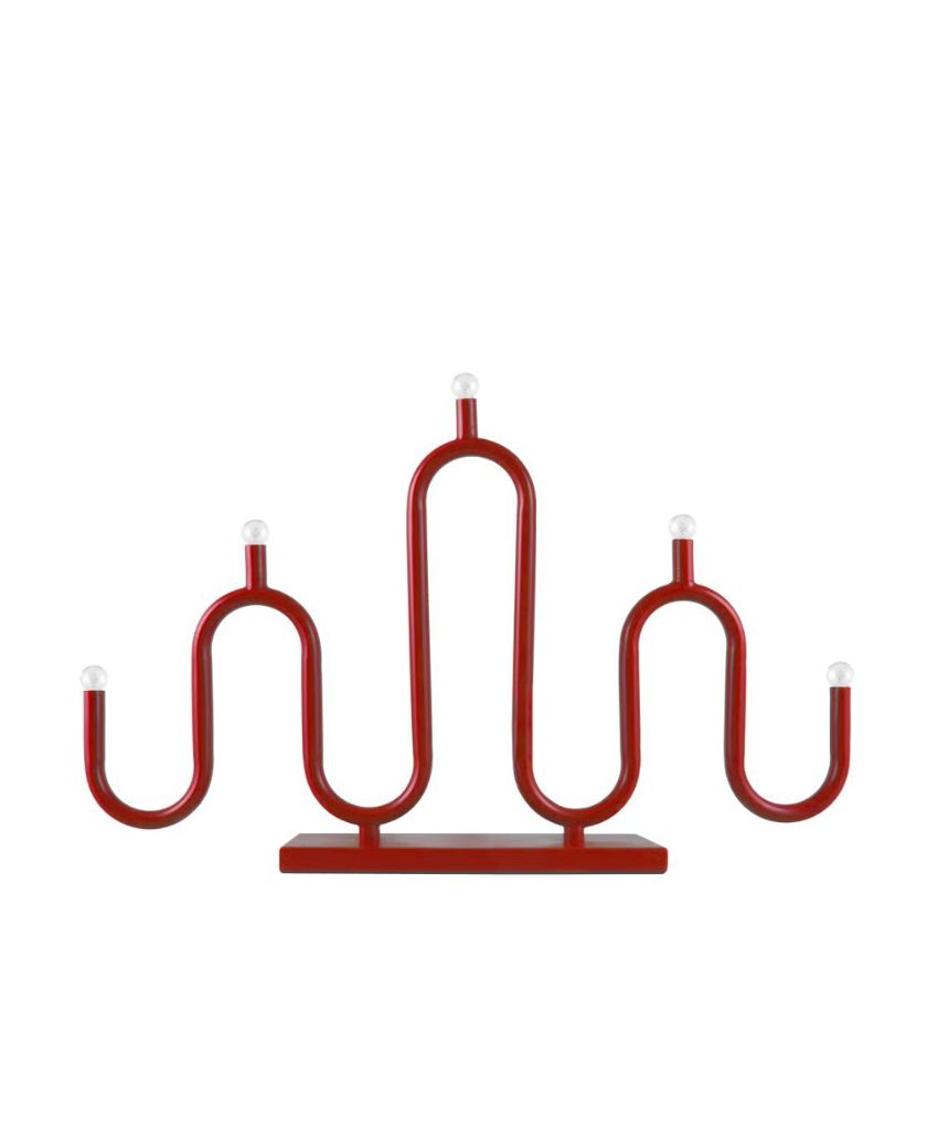 A modern red candle holder with a wavy, symmetrical design featuring five upward curves, each topped with a small white bulb, set on a rectangular red base.