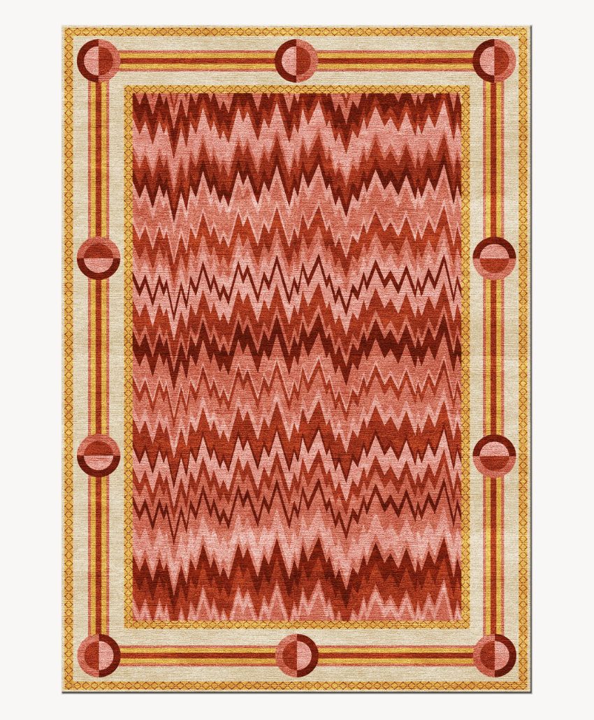 Rectangular rug with a zigzag chevron pattern in red and pink hues in the center, bordered by a gold and cream design with red circular accents at intervals around the edge.