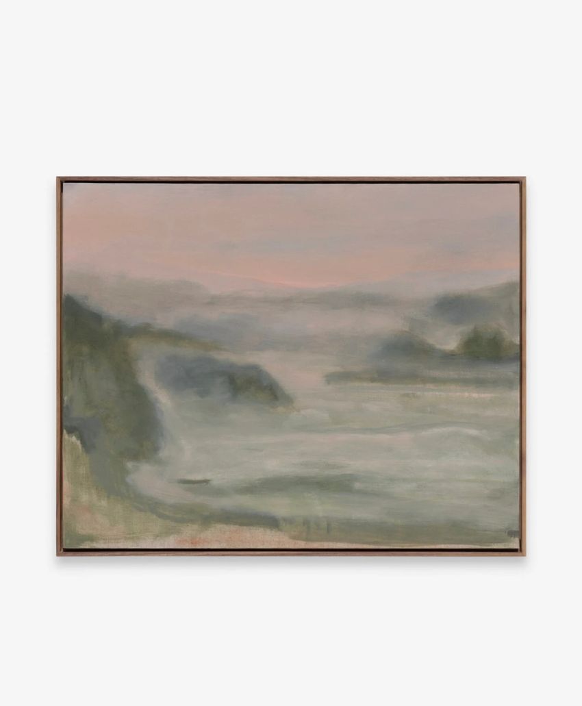 A framed painting of a misty landscape with soft, blurred green hills and a pale pink sky, evoking a calm and tranquil atmosphere.