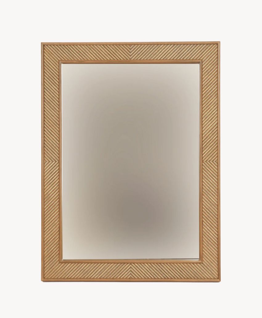 A rectangular wall mirror with a textured, light brown wooden frame featuring diagonal grooves. The mirror is centered and the background is plain white.