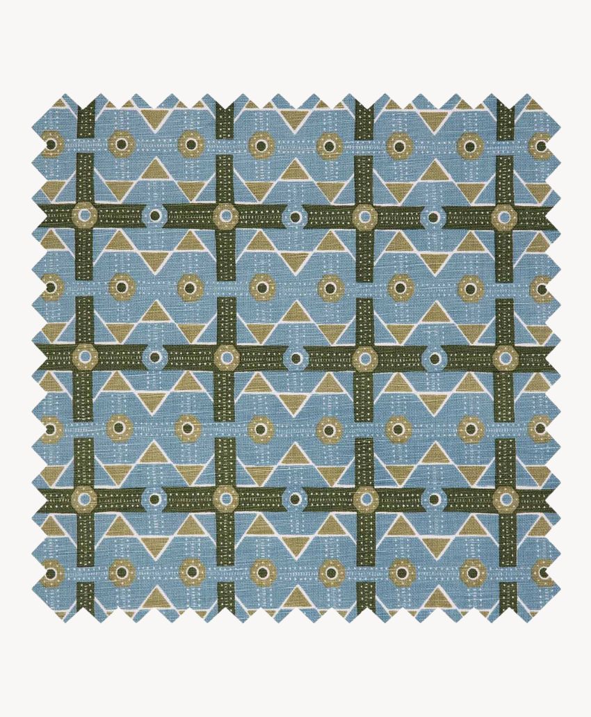 Square fabric swatch with a geometric pattern in blue, olive green, white, and tan, featuring triangles, circles, and grid-like lines, with zigzag edges against a light background.