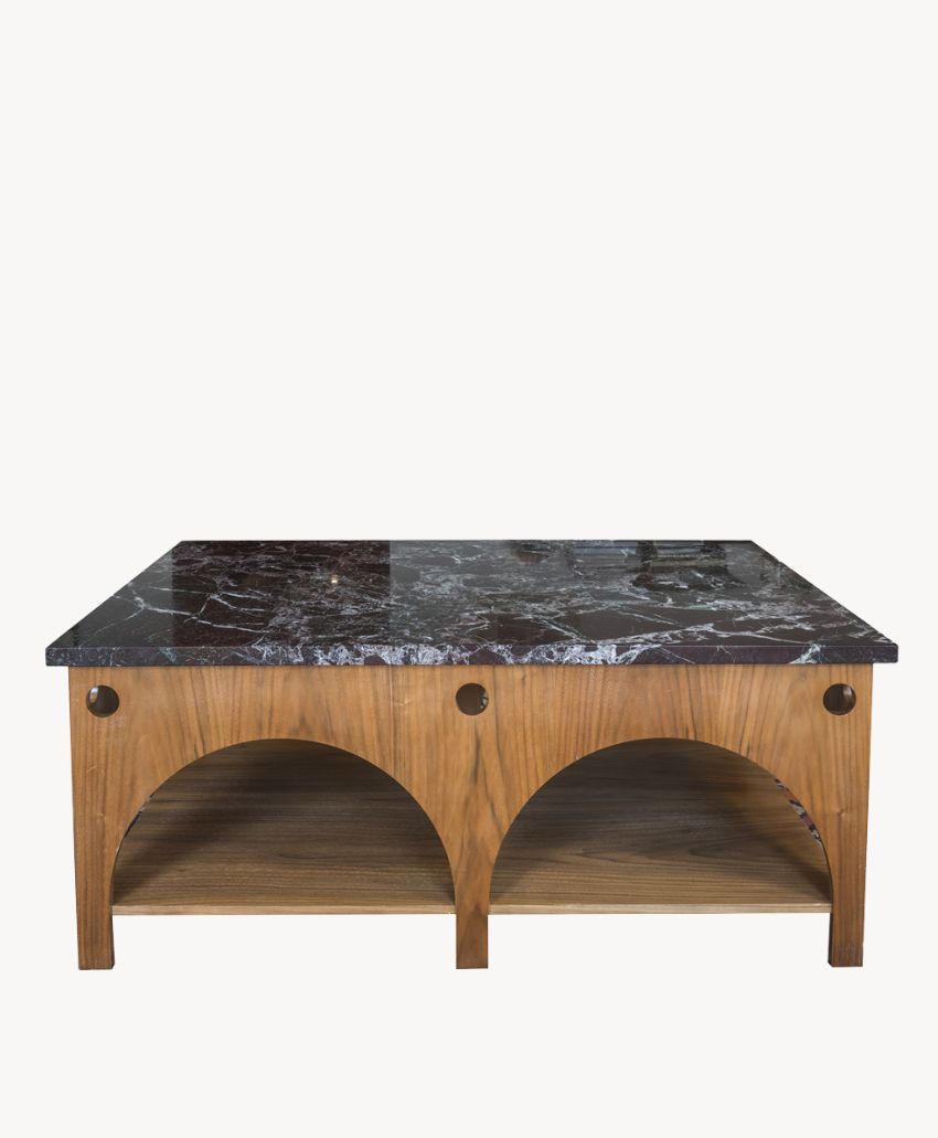 A square wooden coffee table with a dark marble top, featuring two arch-shaped open shelves on the front.