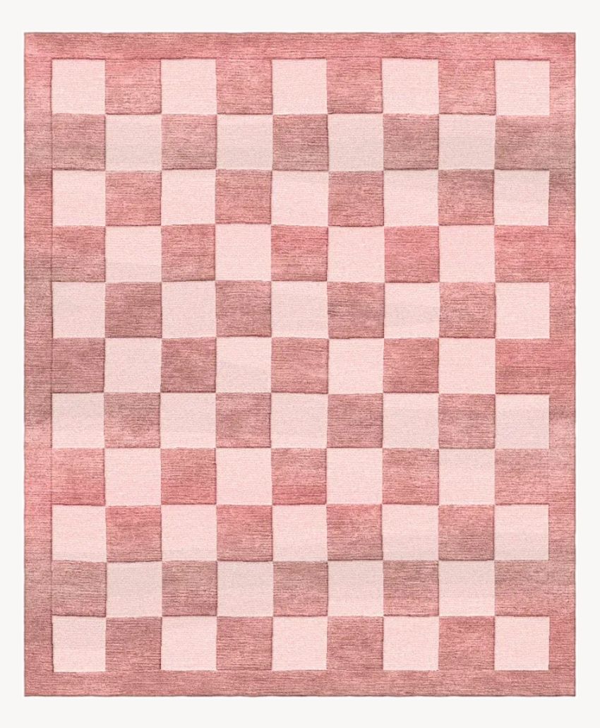 A chessboard pattern with alternating light pink and dark pink squares arranged in an 8 by 8 grid on a white background.