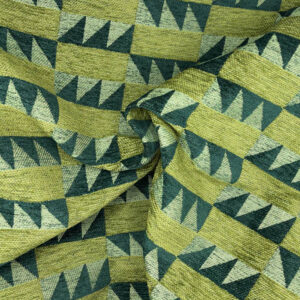 Green and yellow fabric with a geometric pattern of alternating triangles and rectangles, creating a visually dynamic, repeating design. The fabric is slightly wrinkled and gathered in the center.