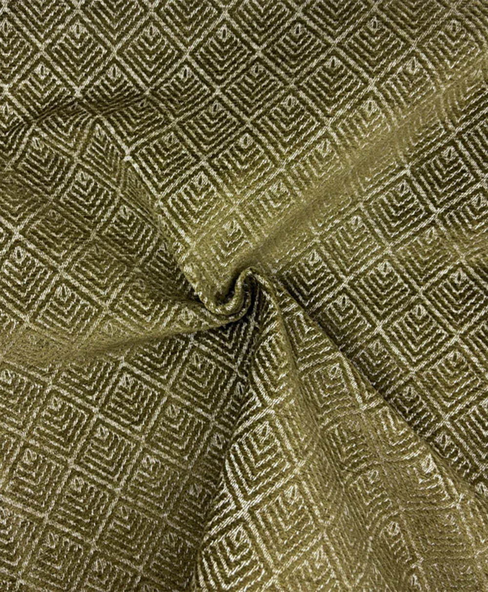 Olive green fabric with a textured diamond pattern, gathered slightly at the center to create a spiral fold. The geometric design features raised lines forming concentric squares within each diamond.