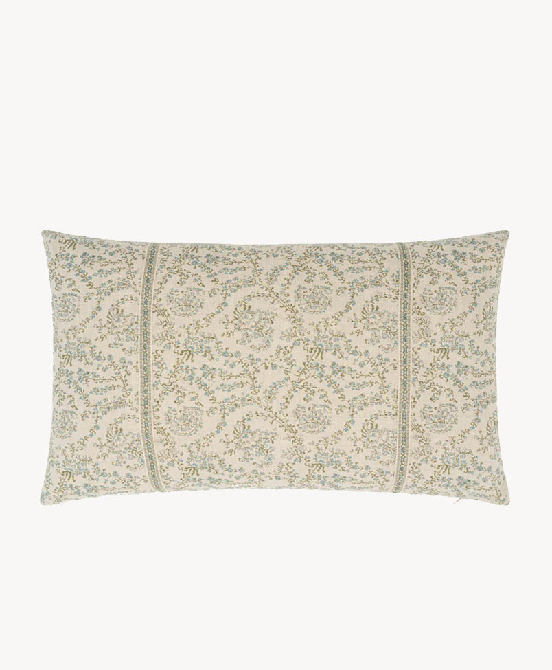 A rectangular decorative pillow with a cream background and an intricate light green and blue floral pattern, featuring two vertical stitched lines for added detail.