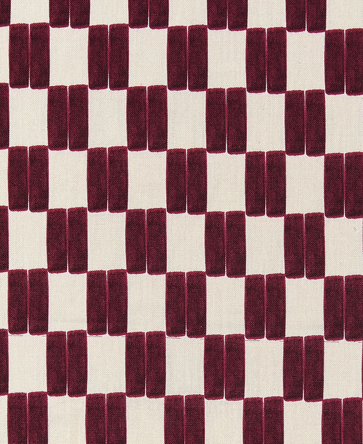 A repeating geometric pattern of maroon rectangles arranged in staggered rows on an off-white background, creating a checkerboard effect.