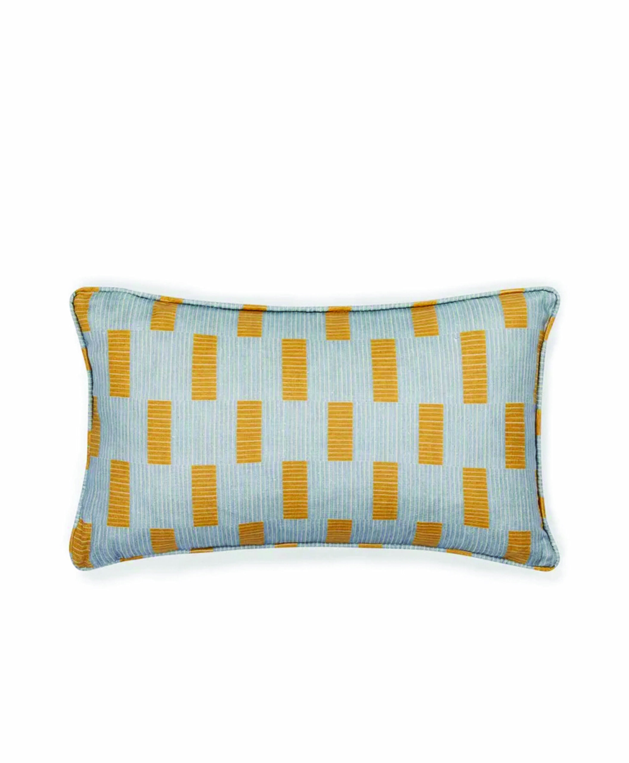 Rectangular throw pillow with a light blue background and a pattern of vertical mustard yellow rectangles. The pillow has a piped edge in a matching blue color.
