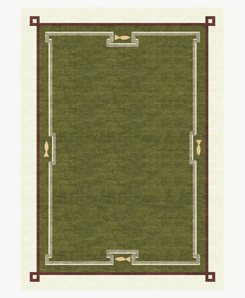 A rectangular green rug with a geometric border design in cream, brown, and gold. The border features symmetric angular shapes and small gold fish motifs at the top, bottom, and sides.
