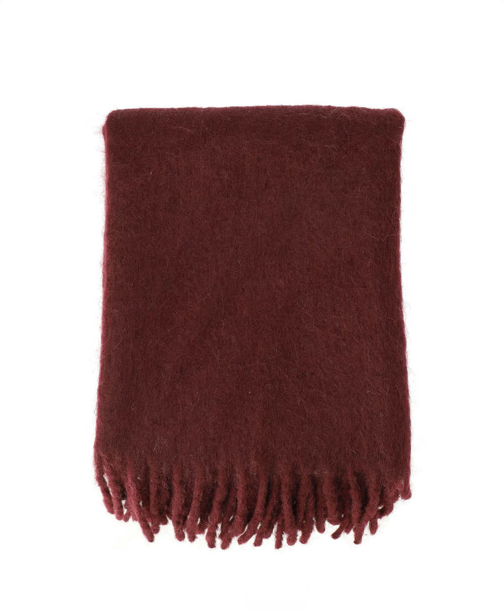 A folded, dark red wool scarf with a fuzzy texture and fringed ends, displayed on a white background.