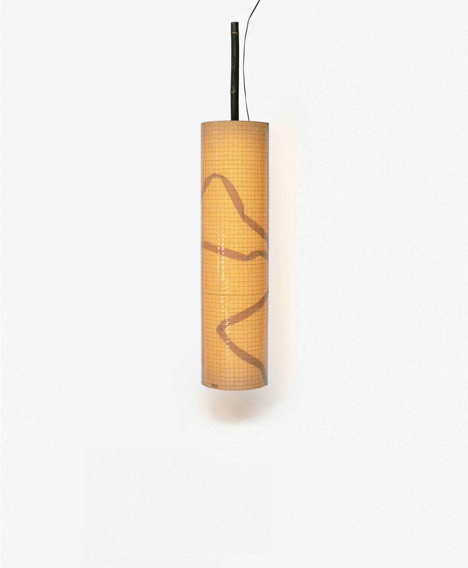 A cylindrical hanging lampshade with a warm yellow glow, grid pattern, and a wavy brown line design, suspended by a black cord against a plain white background.
