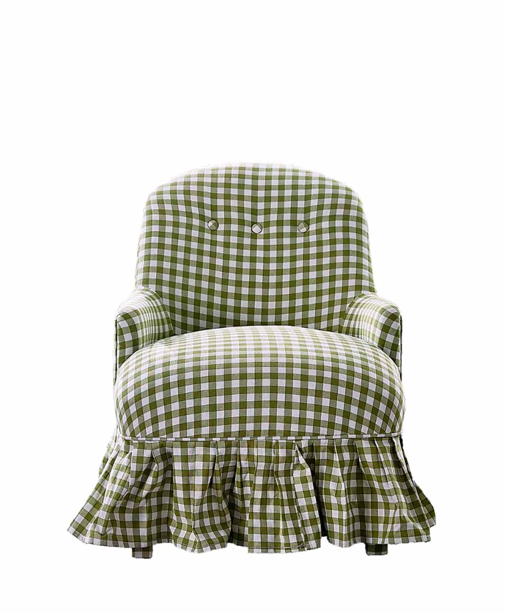 A green and white checkered armchair with a ruffled skirt and button details on the backrest, shown against a white background.