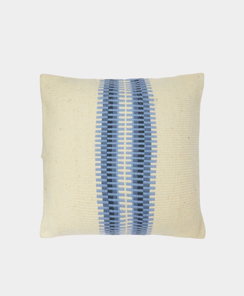Rectangular cream-colored pillow with two vertical blue geometric stripes running down the center. The pattern features varying shades of blue, creating a textured, woven appearance on a plain background.
