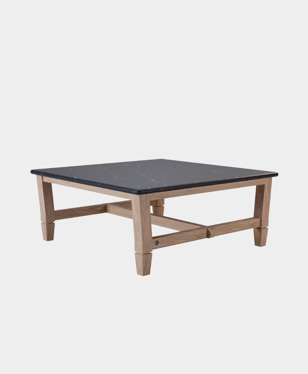 A square coffee table with a black tabletop and light wooden legs, shown against a plain white background.