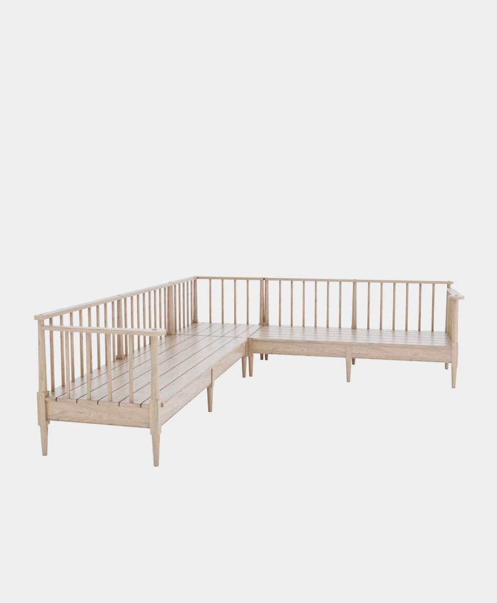 L-shaped wooden bench with back and side railings, light wood finish, and slender legs, displayed against a plain white background.