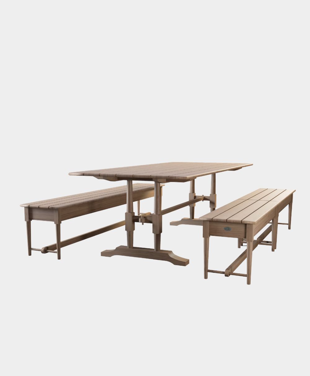 A wooden rectangular table with two matching wooden benches on either side, all set against a plain white background.