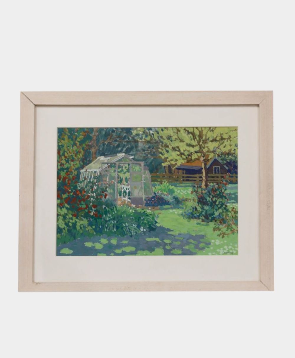 Framed painting of a garden scene featuring a white greenhouse surrounded by greenery, colorful flowers, and trees, with a house and wooden fence in the background.
