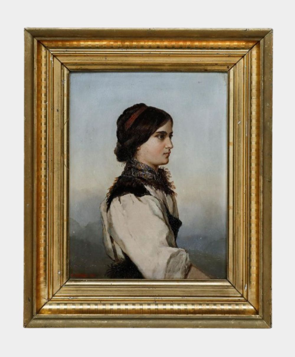 A framed oil painting of a young woman in traditional clothing, shown in profile against a muted background. She has dark hair pulled back, and wears a white blouse with a dark vest and scarf. The frame is gold with decorative details.