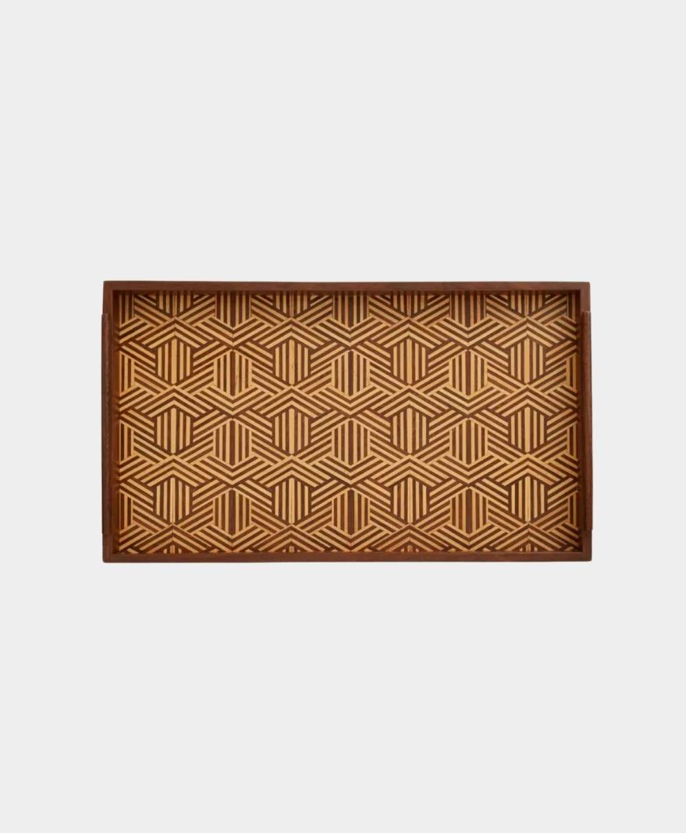 Rectangular wooden tray with raised edges, featuring a geometric pattern of intersecting lines and hexagons in light and dark brown tones.