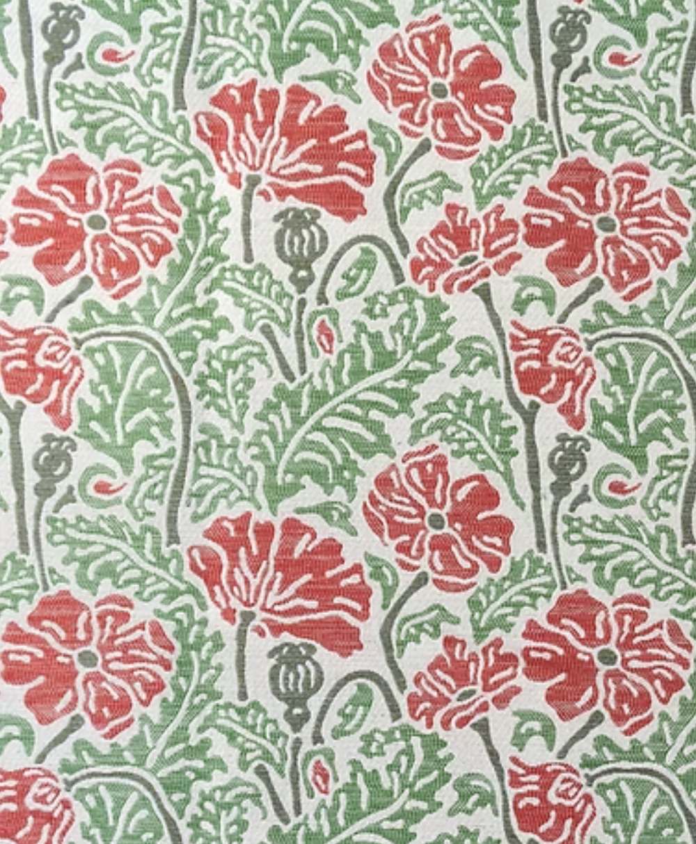 A repeating pattern of red poppy flowers with green leaves and stems, set against a light beige background. The design has a hand-printed, vintage look with detailed botanical shapes.