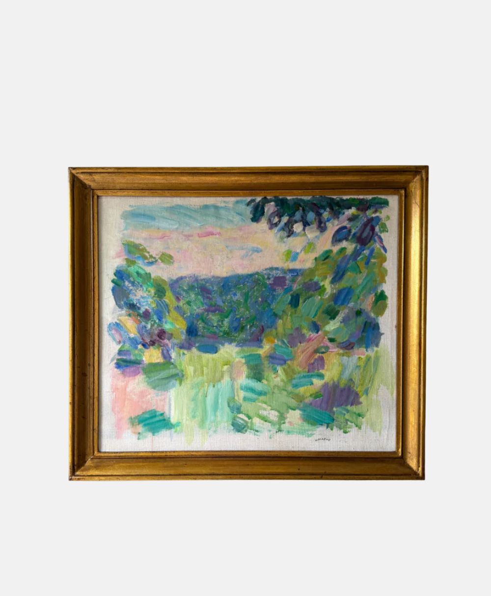 Framed abstract painting with bold, colorful brushstrokes in green, blue, purple, and pink tones, resembling a landscape. The frame is gold and rectangular, and the background is plain white.